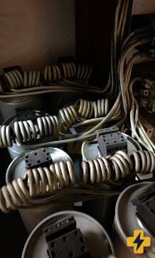 Capacitors inside an industrial power factor correction bank